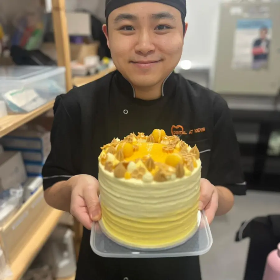 Dr Patrick Ta Holding A Yellow Cake