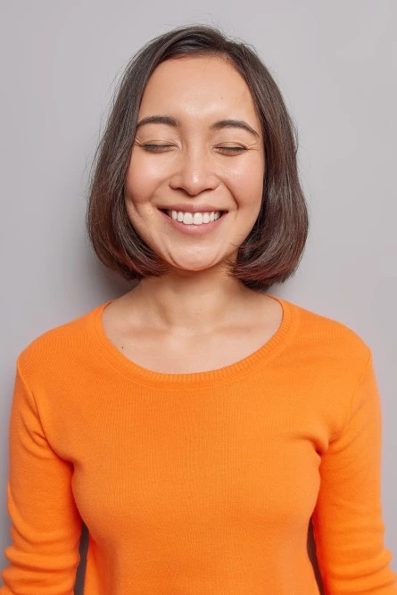 Smiling Asian Lady With Dental Crowns Portrait